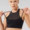 MEDIUM SUPPORT SPORTS BRA WITH MESH FRONT AND CROSS BACK - Medium Support Sports Bra - Black -FOREVER 21 95fcd81adc44428190df67f042ce7033
